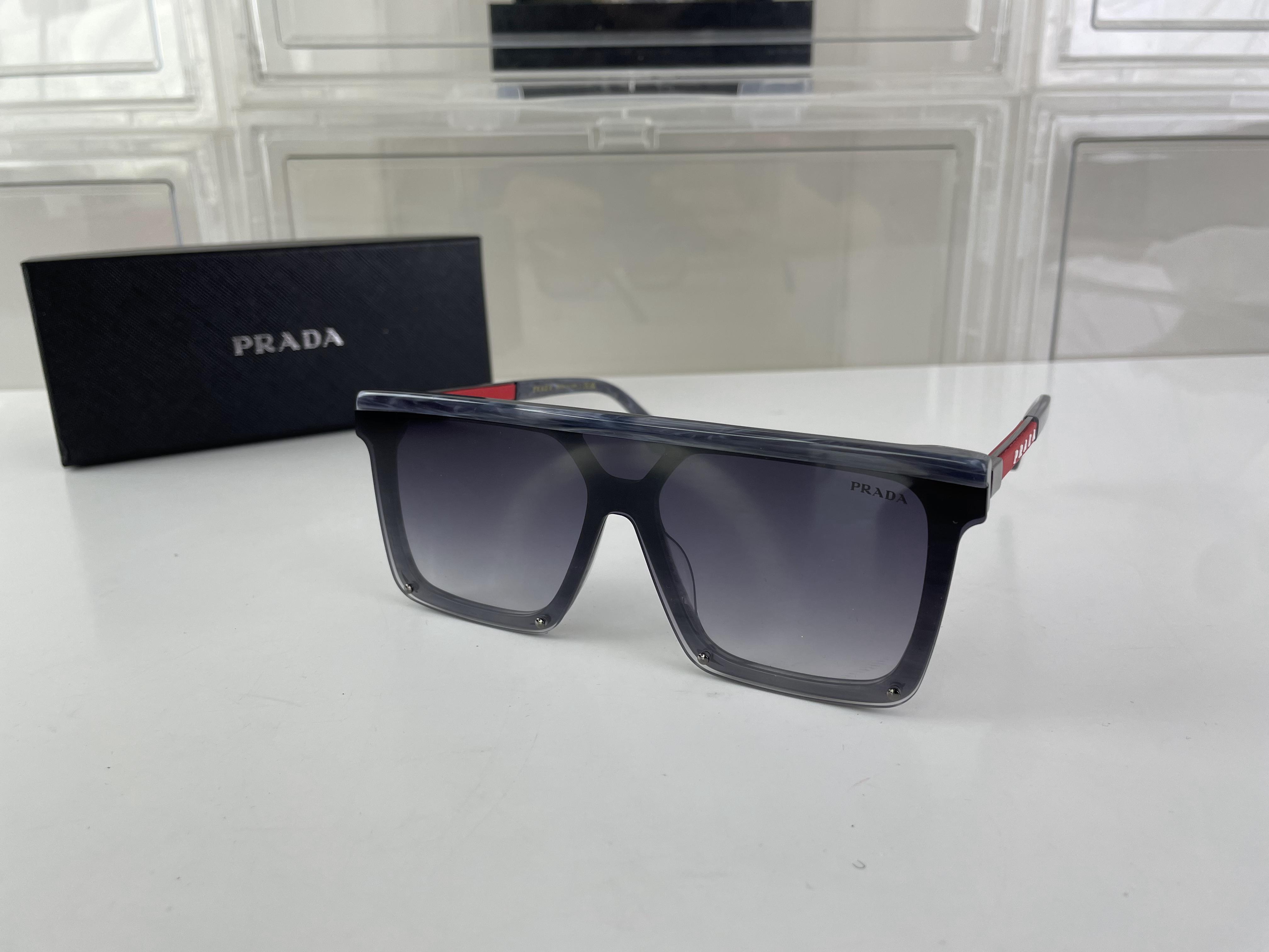 PRADA Grey Flat Sunglass style